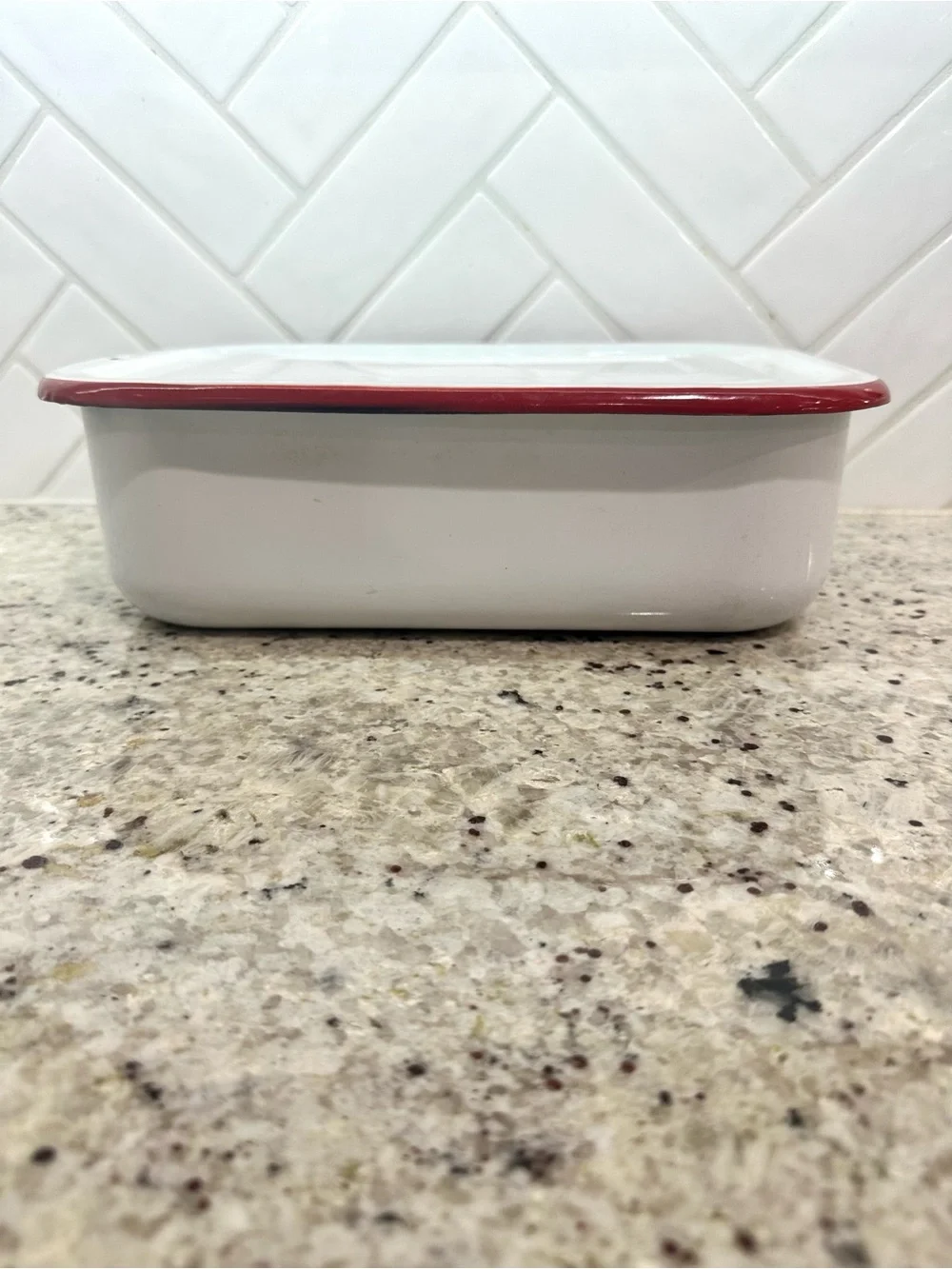 Vintage white enamel pan with red trim